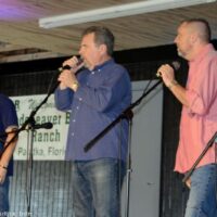 Deeper Shade of Blue trio opens with the national anthem at the 2023 Palatka Bluegrass Festival - photo © Bill Warren