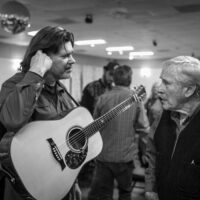 Wally Hughes and Carroll Swam chat at the the Tom Gray/Carroll Swam Birthday Bash at American Legion Post 276 (2/11/23) - photo © Jerome Stephens