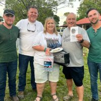First place corn hole winners: Ronnie and Jessica, Jackson, parents of Drive Time‘s Tyler Jackson, with Sideline members Steve Dilling, Kyle Windbeck, and Skip Cherryholmes at the 2023 Big Lick Bluegrass Festival - photo by Sandy Hatley