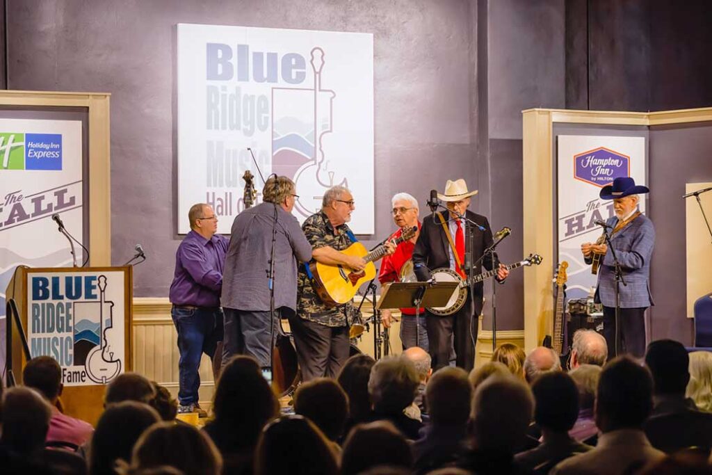 Virginialina with Terry Baucom and Doyle Lawson performing for Barry Poss and Sugar Hill’s induction: (left to right) Scott Freeman, Scott Gentry, David Johnson, Terry Baucom, Eric Elis, Doyle Lawson - photo by Monty and Brenda Combs
