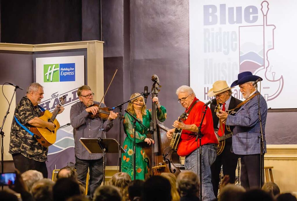 Virginialina performing with Cindy and Terry Bacuom and Doyle Lawson: (left to right) David Johnson, Scott Freeman, Cindy Baucom, Eric Ellis, Terry Baucom, and Doyle Lawson - photo by Monty and Brenda Combs