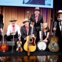 NASHVILLE, TENNESSEE - MAY 22: (L-R) Jeff White, Johnny Warren, Shawn Camp, Charlie Cushman, Alison Brown and Jerry Douglas seen with Earl Scruggs's Gibson RB-Granada Mastertone Banjo and four other original instruments from Flatt & Scruggs's band during the celebration of the donation of Earl Scruggs's Gibson RB-Granada Mastertone Banjo to the Country Music Hall of Fame and Museum's permanent collection on May 22, 2023 in Nashville, Tennessee. (Photo by Jason Kempin/Getty Images for the Country Music Hall of Fame and Museum)