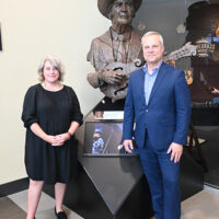 Opry’s Archive Manager, Jen Larson, and Chris Joslin at the unveiling of the Bill Monroe sculpture at the Bluegrass Music Hall of fame & Museum, May 12, 2023