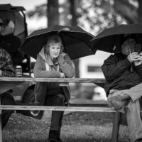 Hard core bluegrass fans brave the rain at the inaugural Tony Rice Memorial Day Musicfest at Camp Springs (5/27/23) - photo © Jeromie Stephens