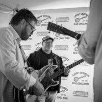 Ron Stewart and Mike Anglin warm up with Southern Legacy backstage during the inaugural Tony Rice Memorial Day Musicfest at Camp Springs (5/27/23) - photo © Jeromie Stephens