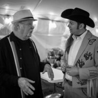 Dudley Connell and Charlie Lowman chat backstage during the inaugural Tony Rice Memorial Day Musicfest at Camp Springs (5/27/23) - photo © Jeromie Stephens