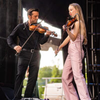 Fiddlin' sweethearts: Jason Carter and Bronwyn Keith-Hynes with Molly Tuttle at DelFest 2023 - photo © Jay Strausser Visuals