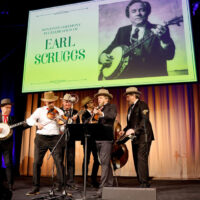 NASHVILLE, TENNESSEE - MAY 22: (L-R) Charlie Cushman, performs with Earl Scruggs’s Gibson RB-Granada Mastertone Banjo, on stage with Johnny Warren, Jeff White, Daniel Kimbro, Shawn Camp and Jerry Douglas of Earls of Leicester during the celebration of the donation of Earl Scruggs's Gibson RB-Granada Mastertone Banjo to the Country Music Hall of Fame and Museum's permanent collection on May 22, 2023 in Nashville, Tennessee. (Photo by Jason Kempin/Getty Images for the Country Music Hall of Fame and Museum)
