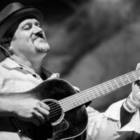 Stephen Mougin with Sam Bush at the 50th anniversary Telluride Bluegrass Festival (2023) - photo © Anthony Verkuilen