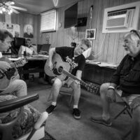 Gary Ferguson, Mark Newton, and Gary Baker warming up at Bluegrass in the 'Burg - photo © Jeromie Stephens