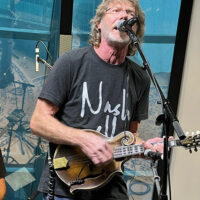 Sam Bush performs at the IBMA Bluegrass Music Awards press conference, held at SiriusXM in Nashville - photo © Terry Herd