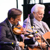 Jason Carter and Del McCoury at the 2023 Grey Fox Bluegrass Festival - photo © Tara Linhardt
