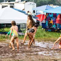 Who can resist a mud puddle at the 2023 Grey Fox Bluegrass Festival - photo © Tara Linhardt