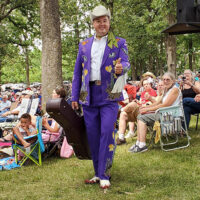 Kody Norris heads stageward at the 2023 July Starvy Creek Bluegrass Festival - photo by Tammy Harman