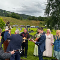 Nick Chandler & Delivered perform in a cemetery at the 2023 Norsk Countrytreff Music Festival in Breim, Norway - photo by Trudy Chandler