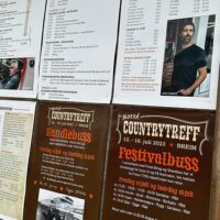 Posters and schedule for at the 2023 Norsk Countrytreff Music Festival in Breim, Norway - photo by Trudy Chandler