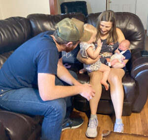 The growing Meadors family: John, Betsy, Gracie, and Adam