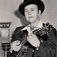A young Bill Monroe with his Loar-signed F-5, still intact