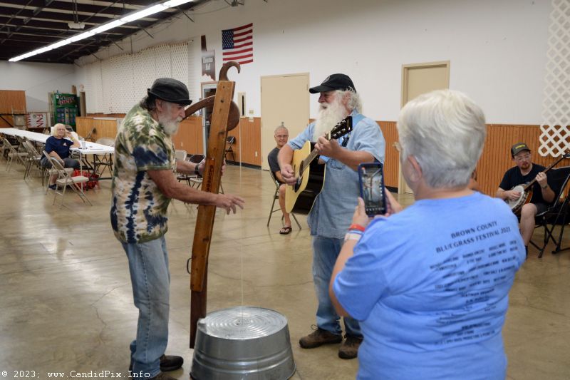 Uncle Elmo and Jerry Eicher at the instrument petting zoo at the 2023 Brown County Bluegrass Festival - photo © Bill Warren