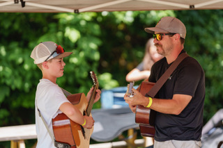 Hudson (first youth guitar) and Austin Mikel at the 2023 Ashe County Bluegrass and Old Time Fiddlers' Convention
