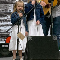 Guest vocalists with Laurel River Line at the 2023 Pickin' for the Kids Bluegrass festival - photo © Roger Black