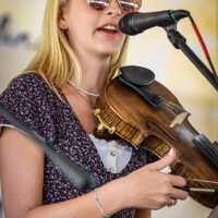 Grace Benus with Grass Strings at the 2023 Grits 'n Grass Music Festival - photo © Laci Mack