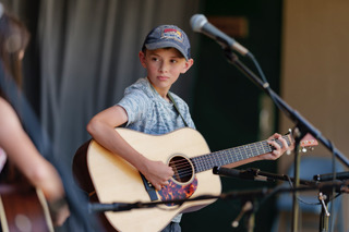 Judas Smith (first youth guitar and bass) at the 2023 Ashe County Bluegrass and Old Time Fiddlers' Convention