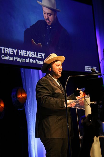 Trey Hensley accepts Guitar Player of the Year at the 2023 IBMA Bluegrass Music Awards - photo © Frank Baker