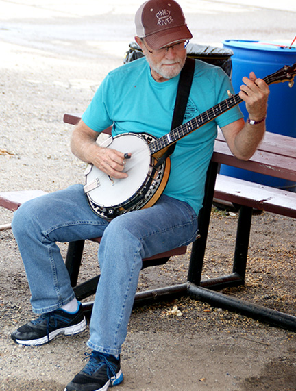 Pickin' that banjo at the 2023 Walnut Valley Festival - photo Walnut Valley Association