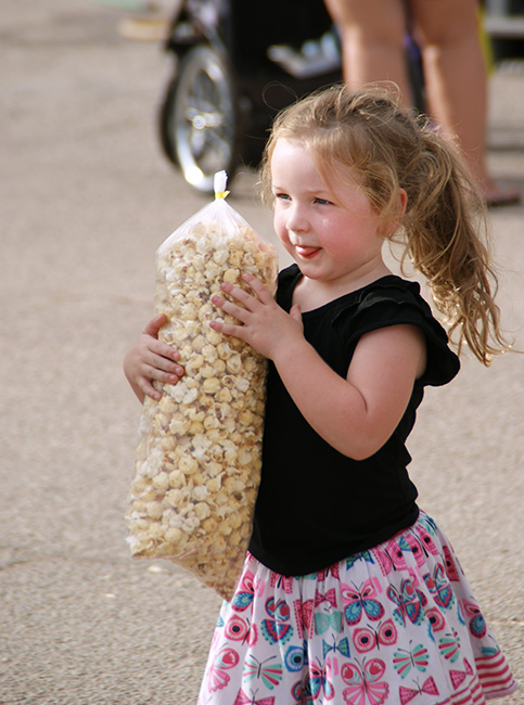 Everyone loves popcorn at the 2023 Walnut Valley Festival - photo Walnut Valley Association