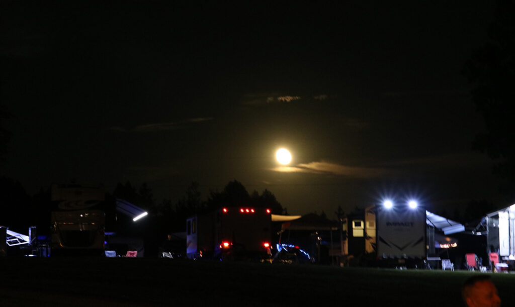 Moon rise over the 2023 Camp Springs Labor Day festival - photo © Laura Tate Photography