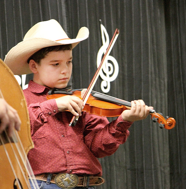 The littlest fiddler at the 2023 Weed Bluegrass Festival - photo © Jay Eschenberg