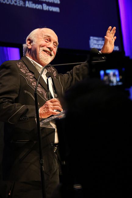 Greg Cahill accepts Collaborative Recording of the Year at the 2023 IBMA Bluegrass Music Awards - photo © Frank Baker