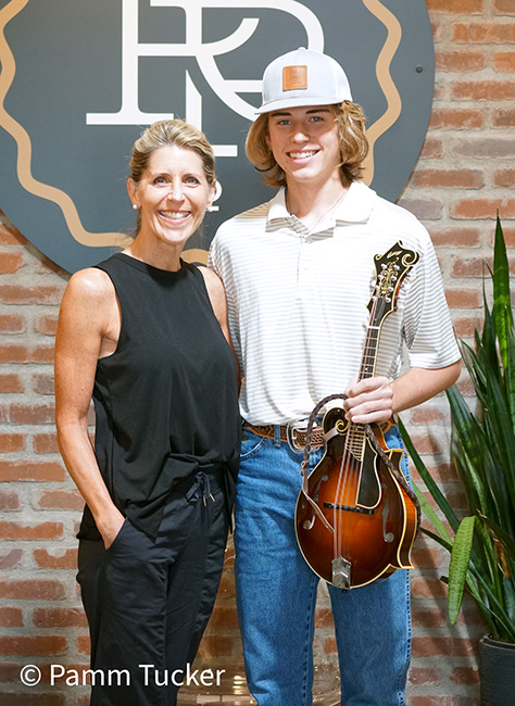 Henry Burgess with his mom, Lynn Muir, and his Collings mandolin