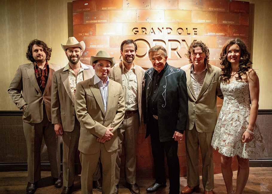 East Nash Grass pose with host Bill Anderson after their Grand Ole Opry debut (10/31/23) - photo © Joe Sanderson