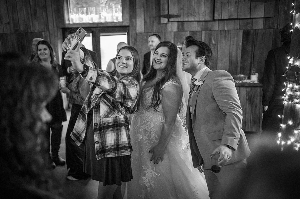 Lily Vincent, cousin to Sally, gets a selfie with the newlyweds (11/2/23) - photo © Jeromie Stephens