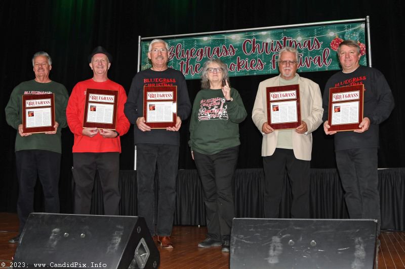 Lorraine Jordan hands out awards to her band at the 2023 Bluegrass Christmas in the Smokies - photo © Bill Warren