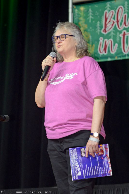 Lorraine Jordan speaks at the 2023 Bluegrass Christmas in the Smokies - photo © Bill Warren