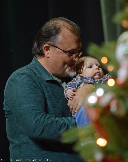 Stetson Harper, son of Jamie and Lakyn Harper, is introduced at the 2023 Bluegrass Christmas in the Smokies - photo © Bill Warren