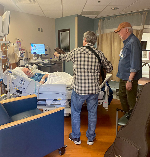 Jerry Salley and Byron Hill share some music with Glen Duncan in the hospital while he recovers from a stroke