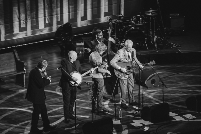 Stuart Duncan, Jim Mills, Sam Bush, Alan Bartram, and Del McCoury at the 100th Birthday Celebration for Earl Scruggs at The Ryman Auditorium (1/6/24) - photo © Bryce LaFoon