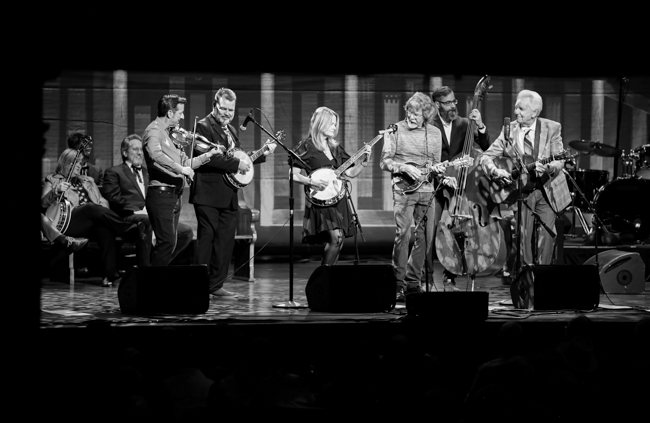Jason Carter, Rob McCoury, Alison Brown, Sam Bush, Alan Bartram, and Del McCoury at the 100th Birthday Celebration for Earl Scruggs at The Ryman Auditorium (1/6/24) - photo © Bryce LaFoon