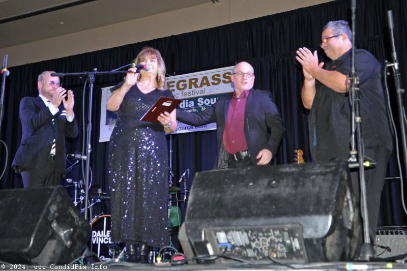 Ernie Evans and Dailey & Vincent present Cindy Baucom with an award at the 2024 Jekyll Island Bluegrass Festival (1/4/24) - photo © Bill Warren