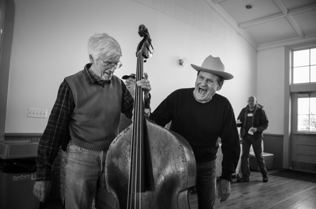 Tom Gray and Jerry McCoury enjoy a laugh at the Lucketts Schoolhouse 50th anniversary celebration (1/2024) - photo © Jeromie Stephens