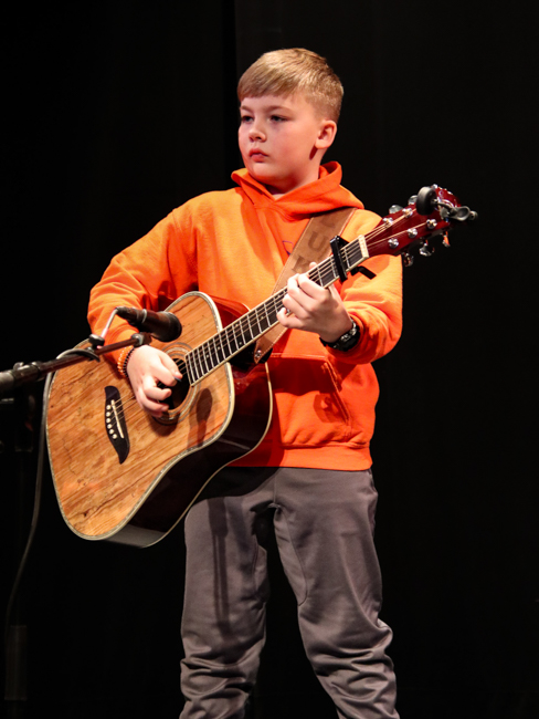 Sweet Potato Pie Kids guitar player at 2024 Winter Bluegrass Jubilee – photo © G Nicholas Hancock