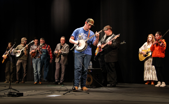 YAM alumnus jamming with Authentic Unlimited and Shannon Slaughter at 2024 Winter Bluegrass Jubilee – photo © G Nicholas Hancock