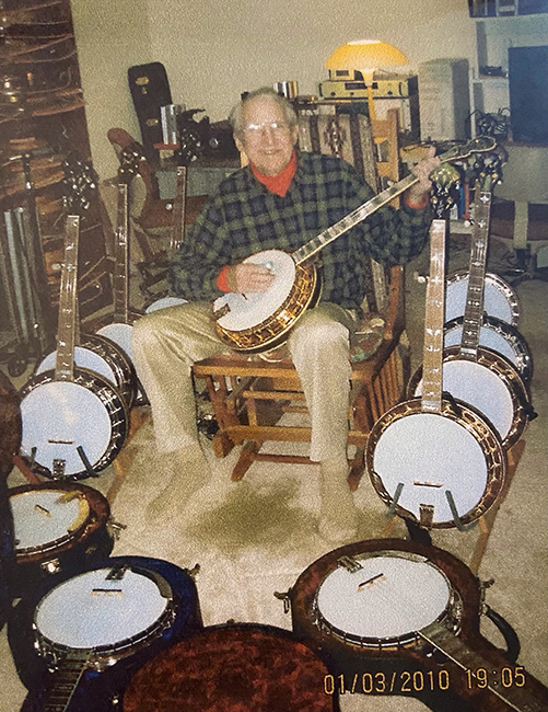 Jim Rae with his banjo collection