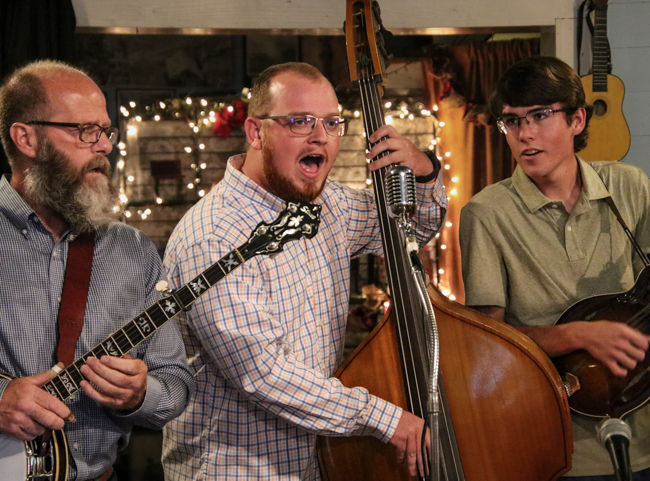 Tom Hyatt, Daniel Schronce, and Jonah Chaney sing at the Greg Blake house concert at the E.H. Montgomery General Store in Gold Hill, NC - photo © G Nicholas Hancock