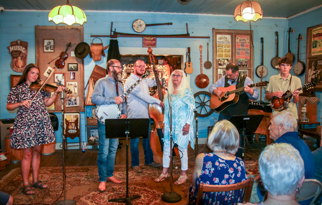 Vivian Pennington Hopkins singing Back to the Cabin in Caroline at the Greg Blake house concert at the E.H. Montgomery General Store in Gold Hill, NC - photo © G Nicholas Hancoc