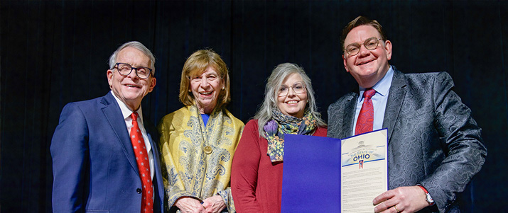Governor Mike Dewine presents Joe Mullins with a proclamation declaring January 9, 2026 as Joe Mullins & The Radio Ramblers Day in Ohio